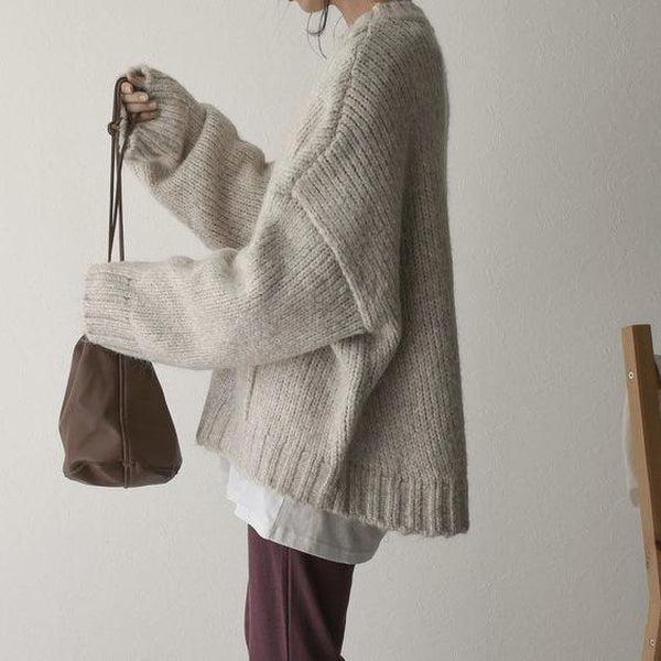 Übergroßer elfenbeinfarbener Pullover mit Vordertasche